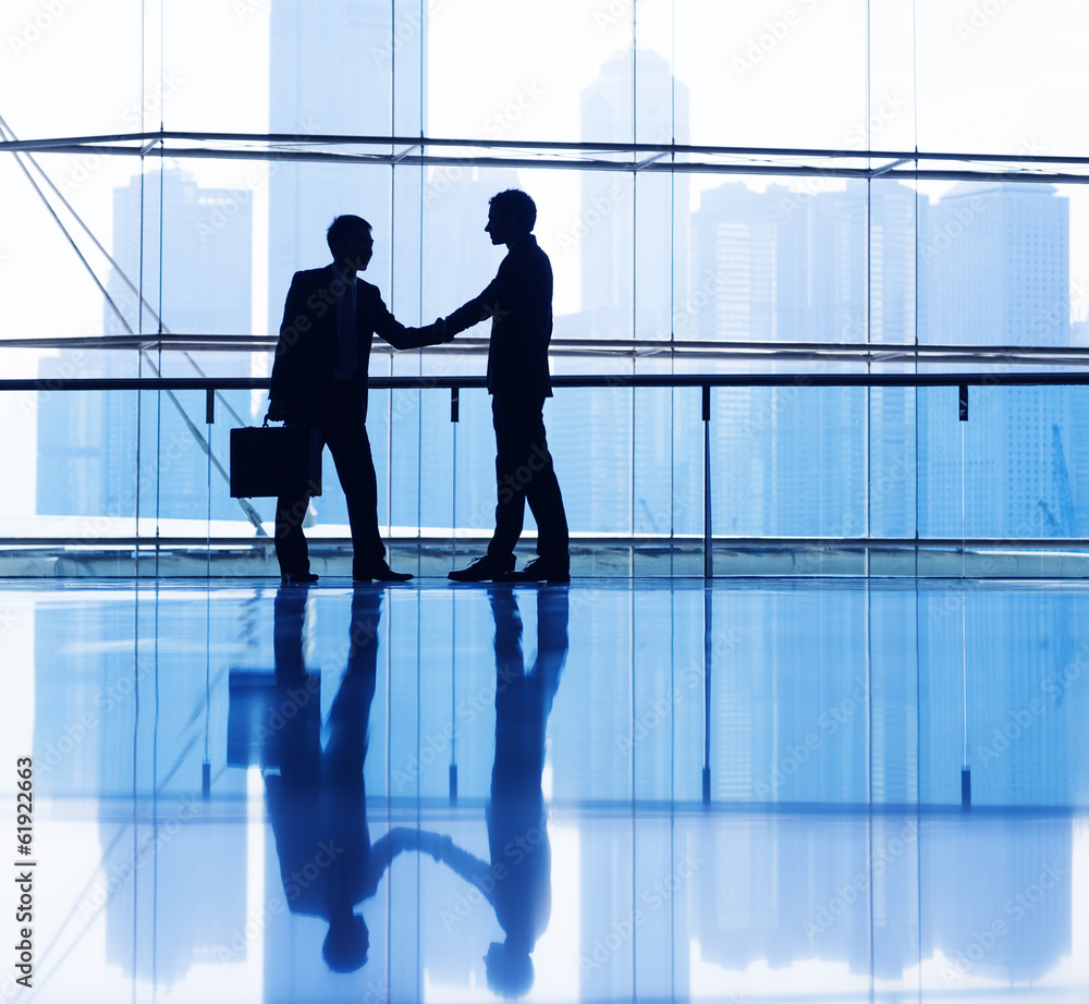 Silhouette of Business People Shaking Hands Silhouette of Business People Shaking Hands