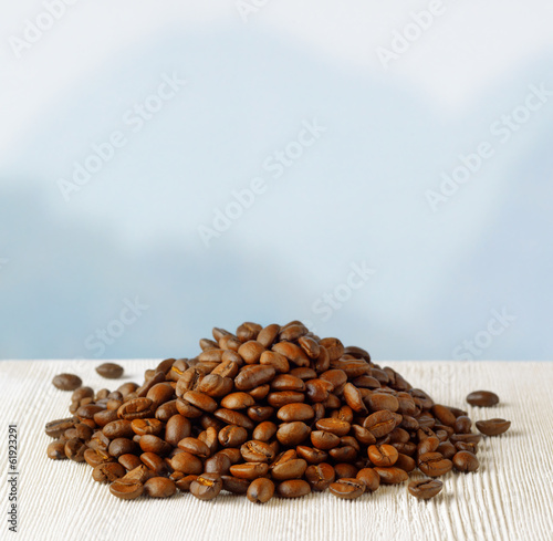 Coffee beans on highlands background
