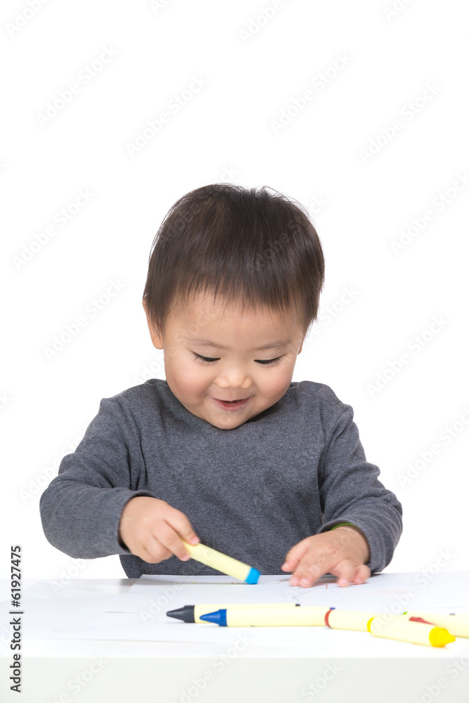 Kid drawing with crayon