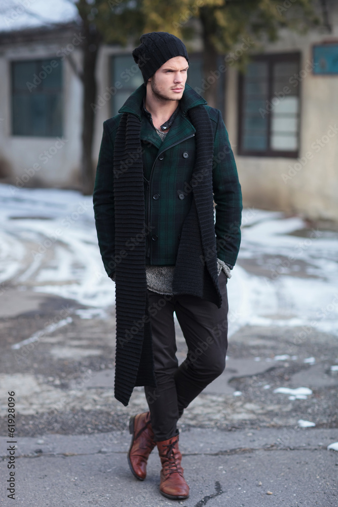 young man with hands in pockets young man with hands in pockets