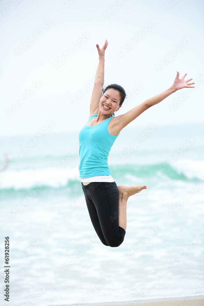 Happy woman jumping on the beach. summer holidays