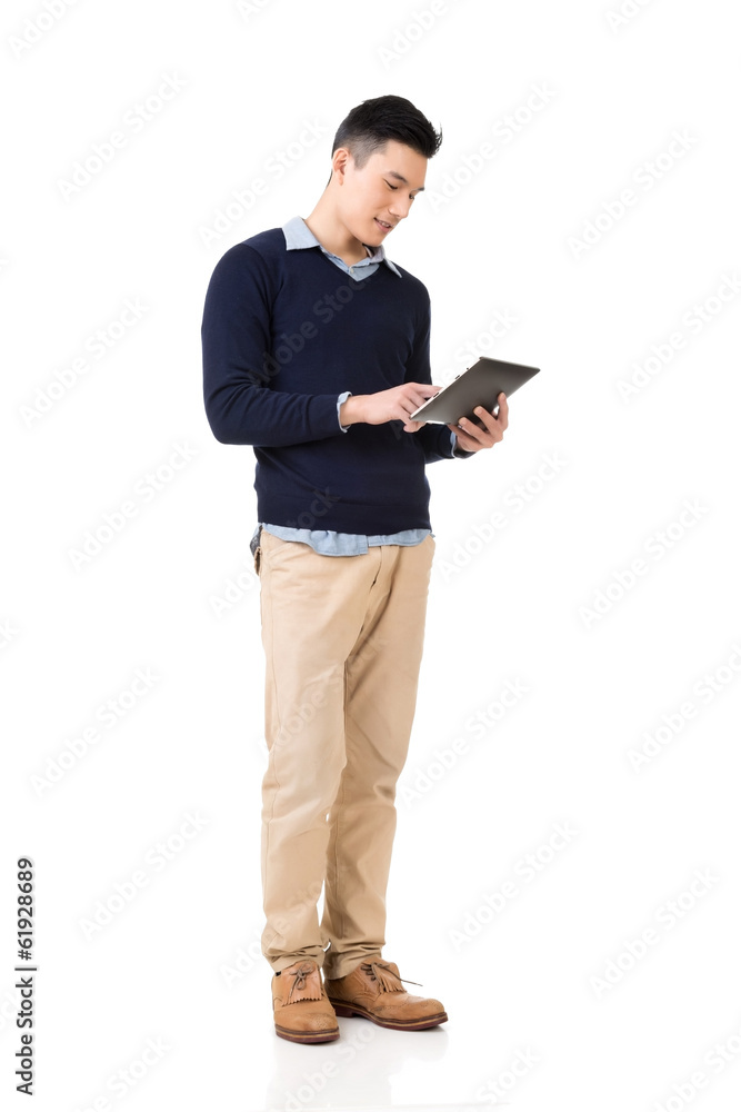 Asian man using pad Asian man using pad