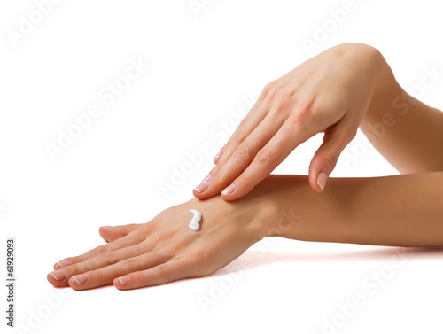 Woman applying cream on her hands