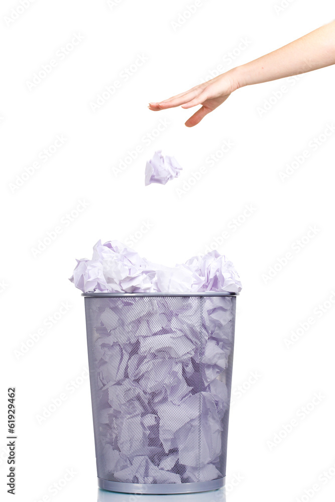 Metal trash bin from paper and hand isolated on white Metal trash bin from paper and hand isolated on white