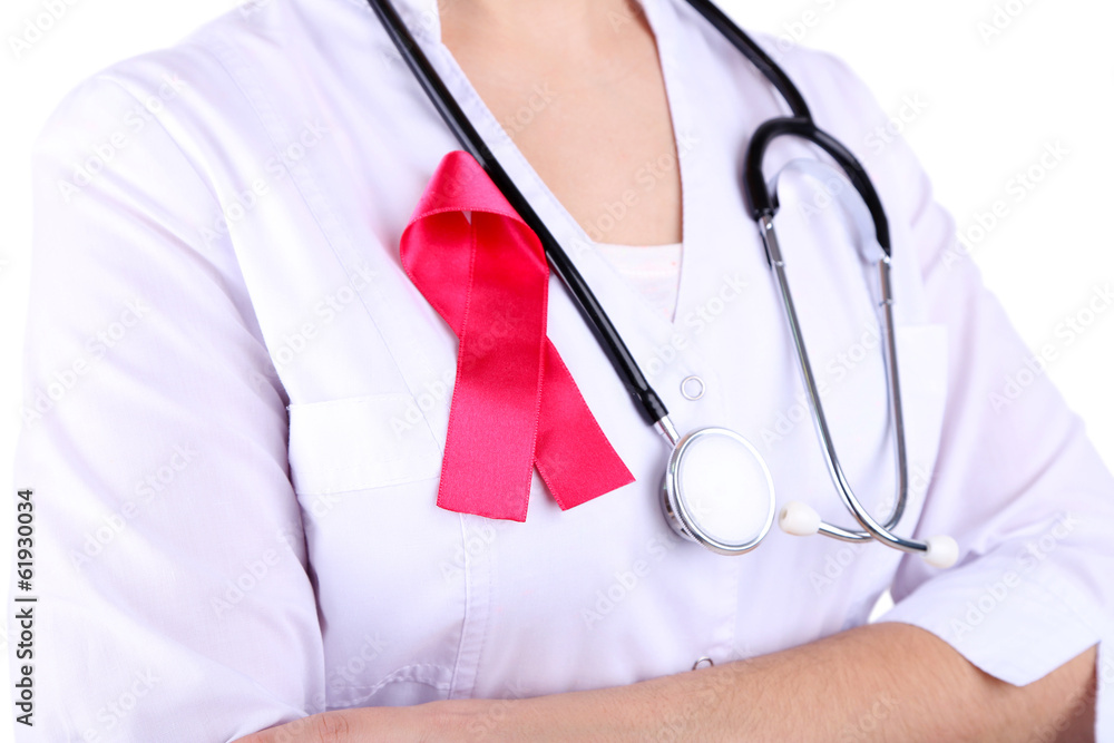 Doctor with ribbon formed Aids symbol, close-up, isolated Doctor with ribbon formed Aids symbol, close-up, isolated