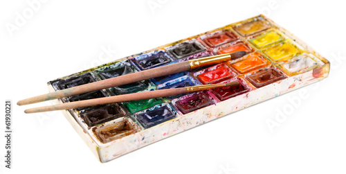 Fotografi Colourful watercolors and brushes isolated on white