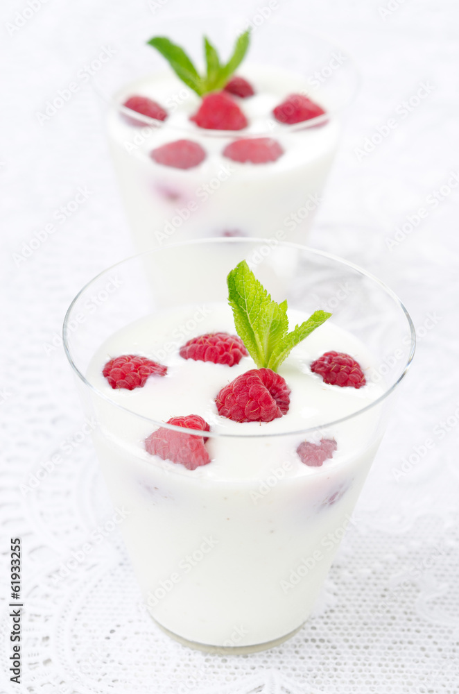 panna cotta with fresh raspberries, vertical close-up panna cotta with fresh raspberries, vertical close-up