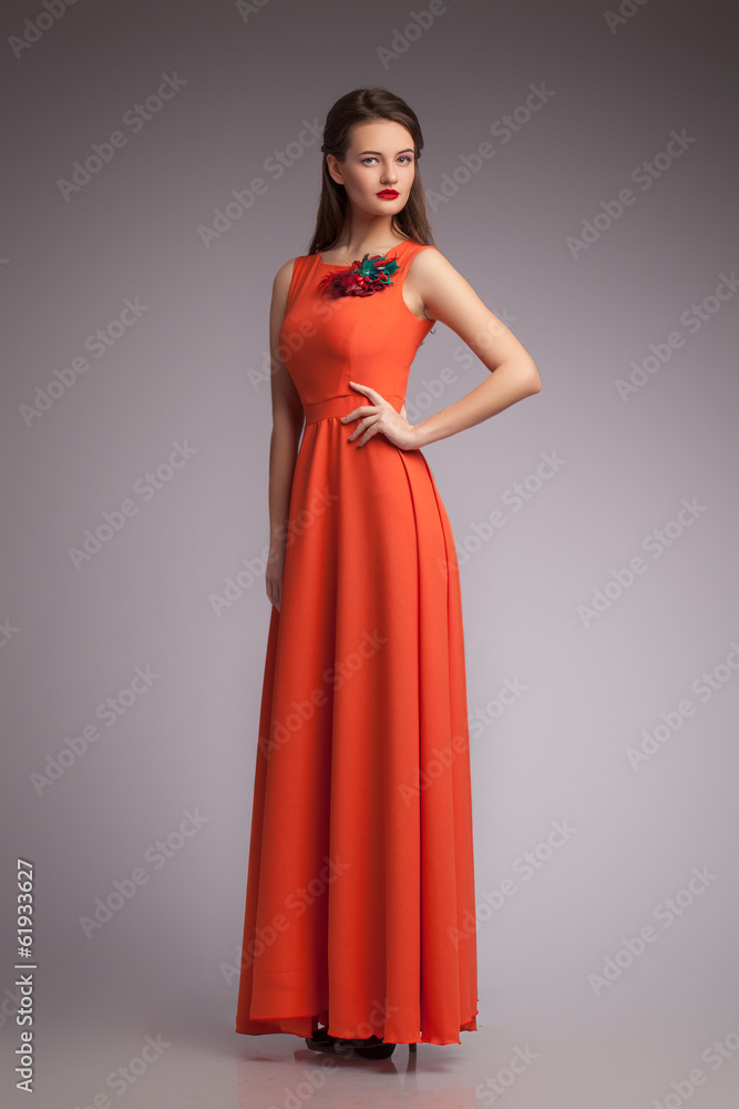 Girl in red dress. Portrait. Studio. Fashion Girl in red dress. Portrait. Studio. Fashion