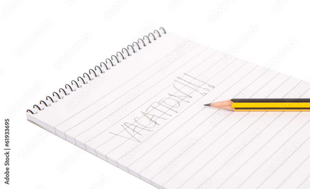 Concept image of the word vacation on a notepad with pencil Concept image of the word vacation on a notepad with pencil