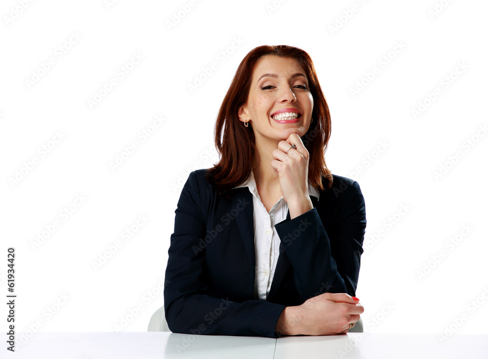 Smiling businesswoman sitting at the table