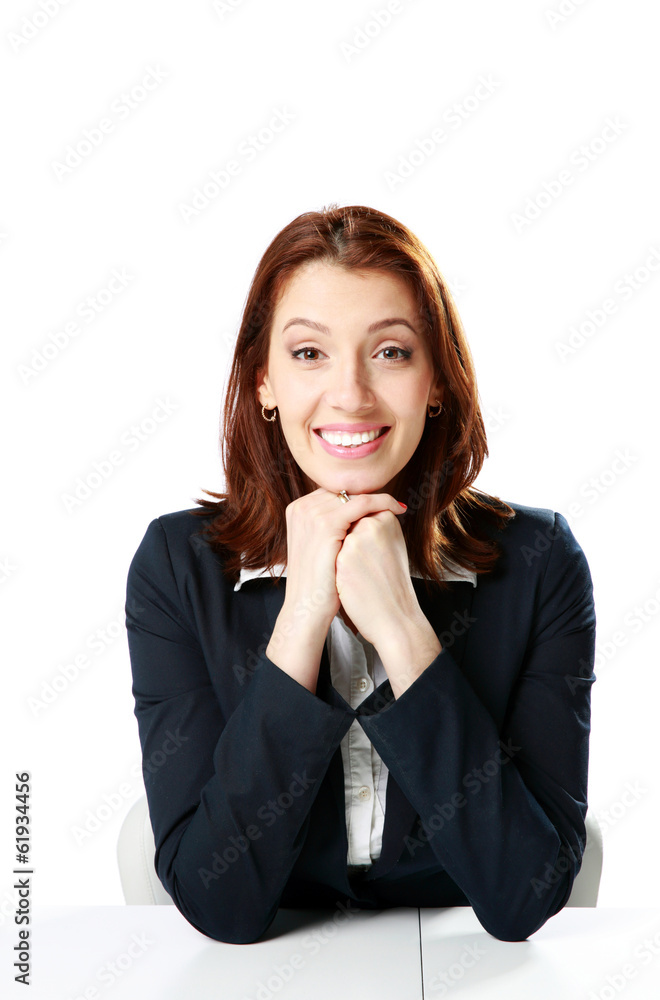 Smiling businesswoman sitting at the table Smiling businesswoman sitting at the table