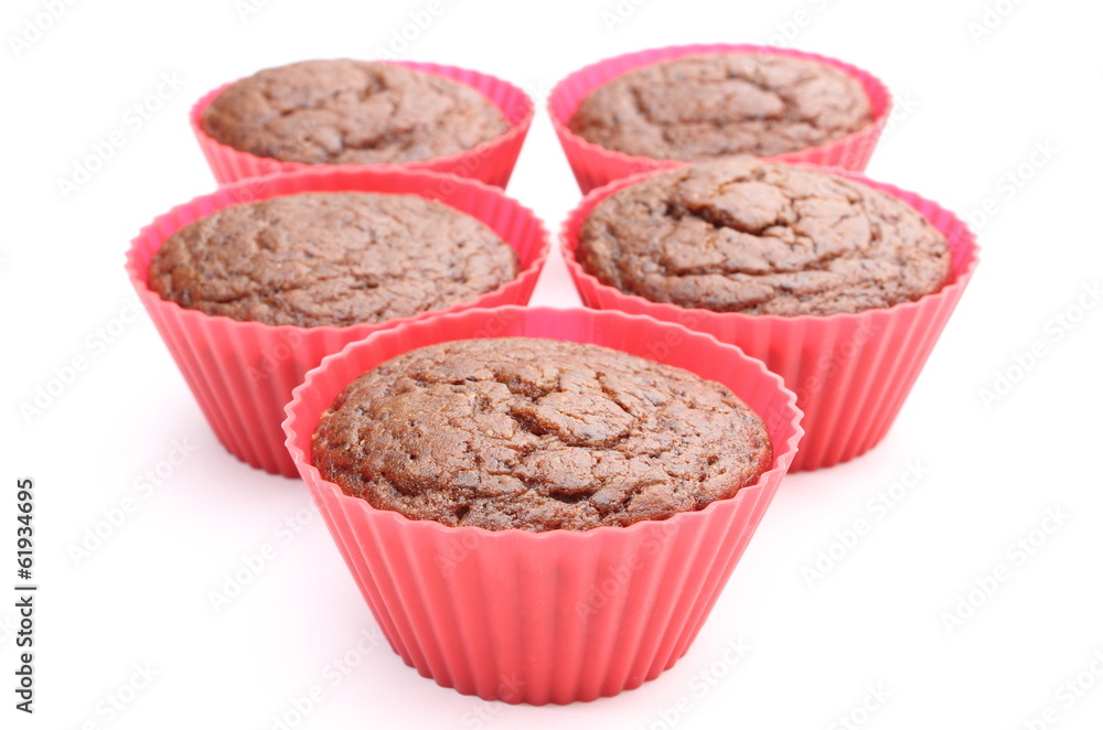 Fresh baked chocolate muffin in red silicone cups Fresh baked chocolate muffin in red silicone cups