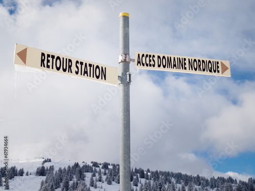 sign post in winter landscape photo