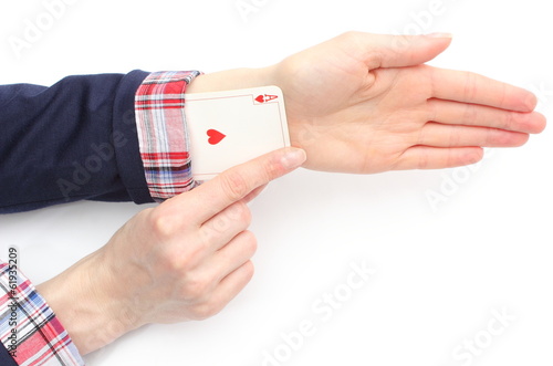 Business woman pulls an ace from his sleeve. White background