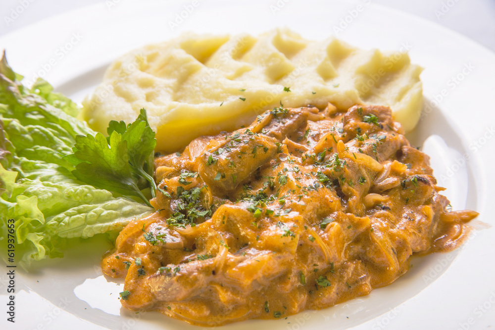 Stew in vegetable sauce with mashed potatoes Stew in vegetable sauce with mashed potatoes