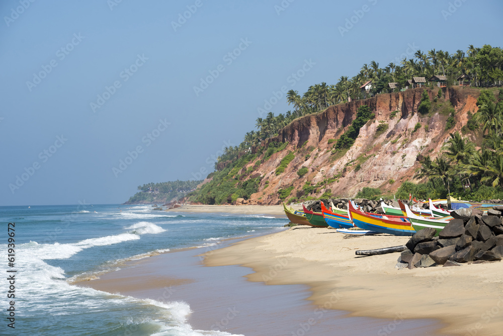 Tropical beach with fishing boats