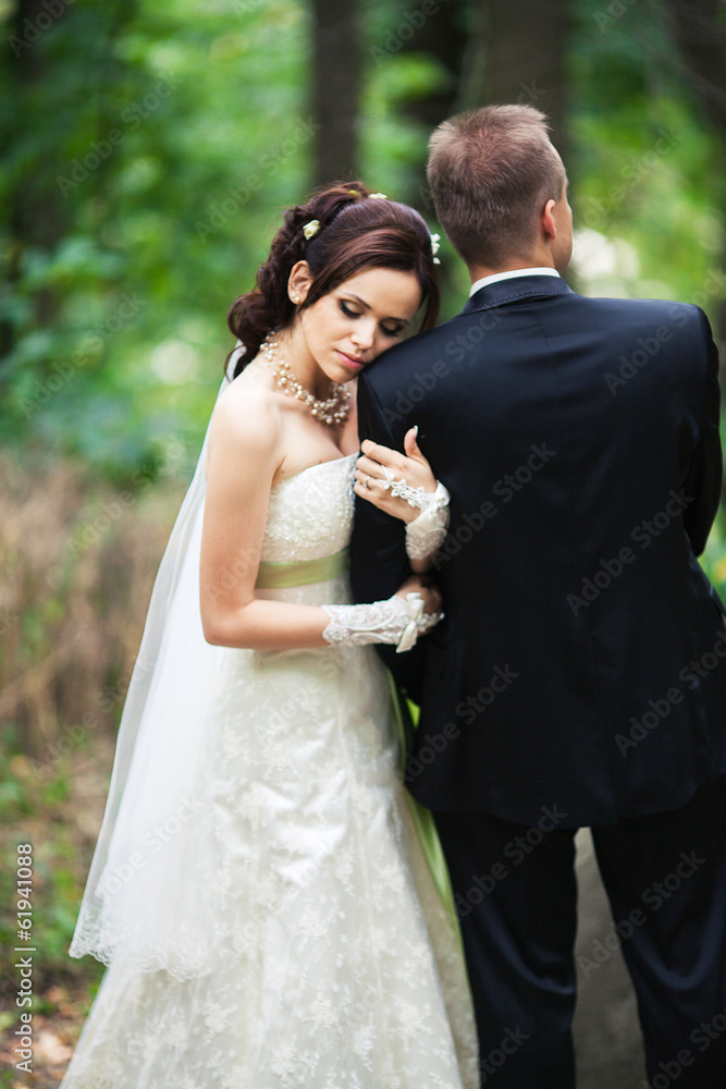 married couple in forest embracing, young groom and bride married couple in forest embracing, young groom and bride