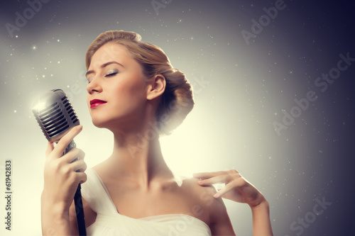 attractive female singer with microphone