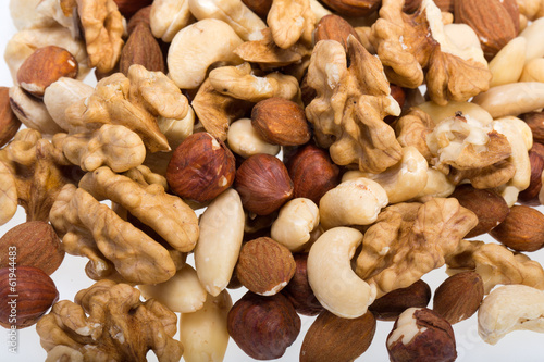 background of mixed nuts -  hazelnuts, walnuts, cashews,