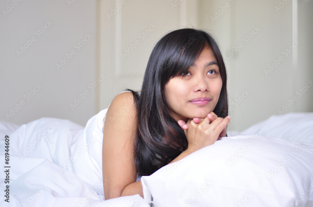 Woman relaxing looking happy and smiling Woman relaxing looking happy and smiling