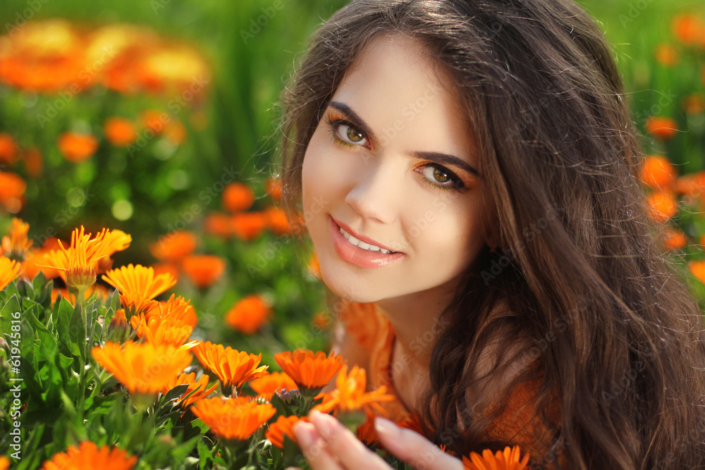 Naklejka premium Happy smiling girl. Beautiful Romantic Brunette female Outdoors