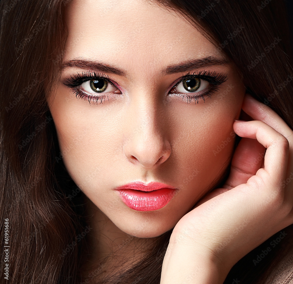 Closeup portrait of makeup woman looking sexy on black Closeup portrait of makeup woman looking sexy on black