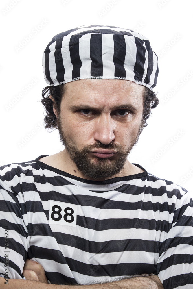 Desperate, portrait of a man prisoner in prison garb, over white Desperate, portrait of a man prisoner in prison garb, over white
