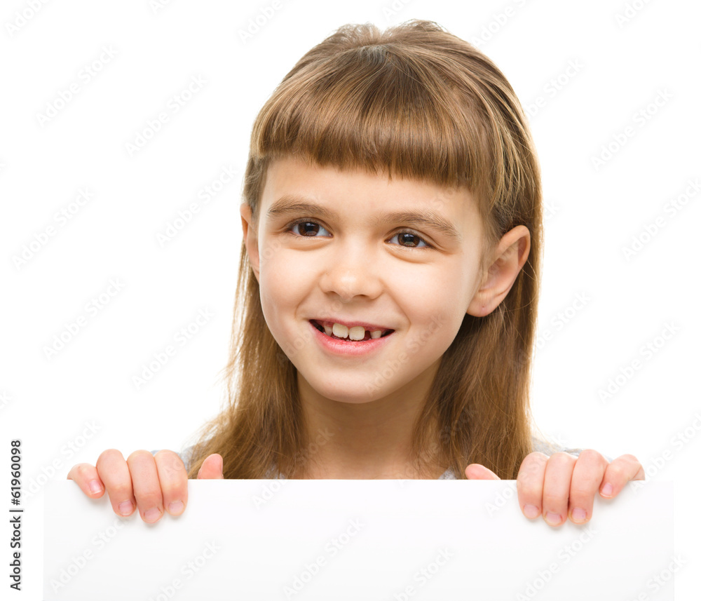 Little girl is holding blank banner Little girl is holding blank banner