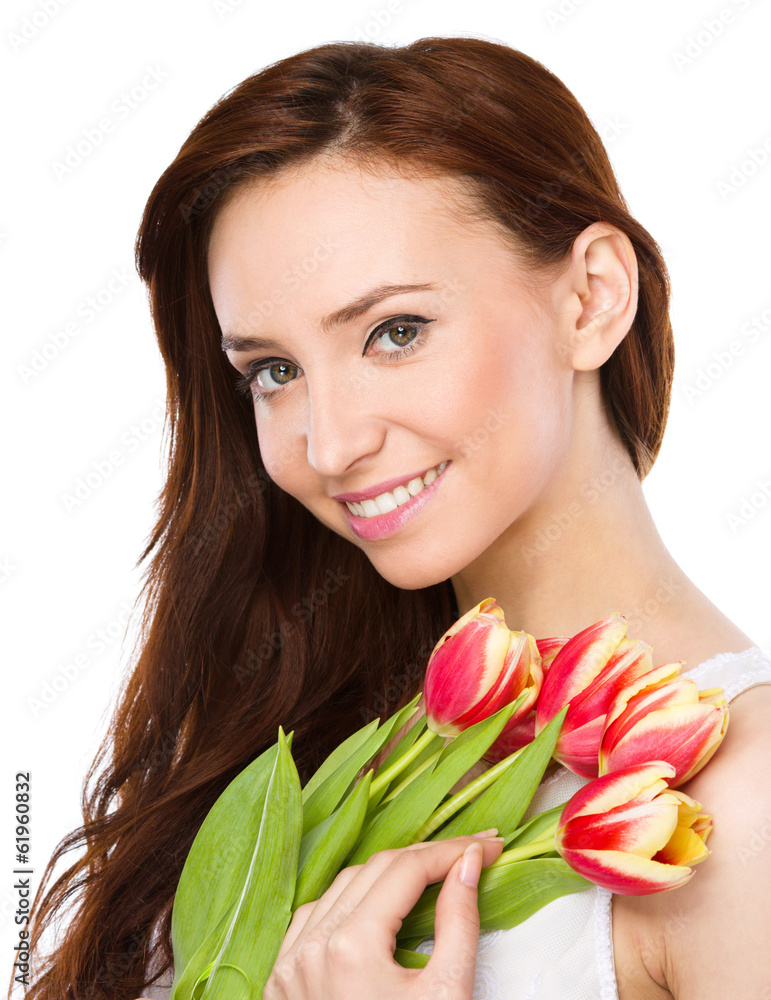 Young woman is holding bouquet of tulips Young woman is holding bouquet of tulips