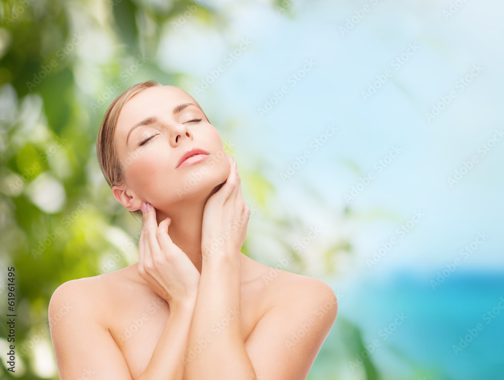 beautiful woman touching her face with closed eyes beautiful woman touching her face with closed eyes