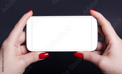 white mobile phone in a female hand
