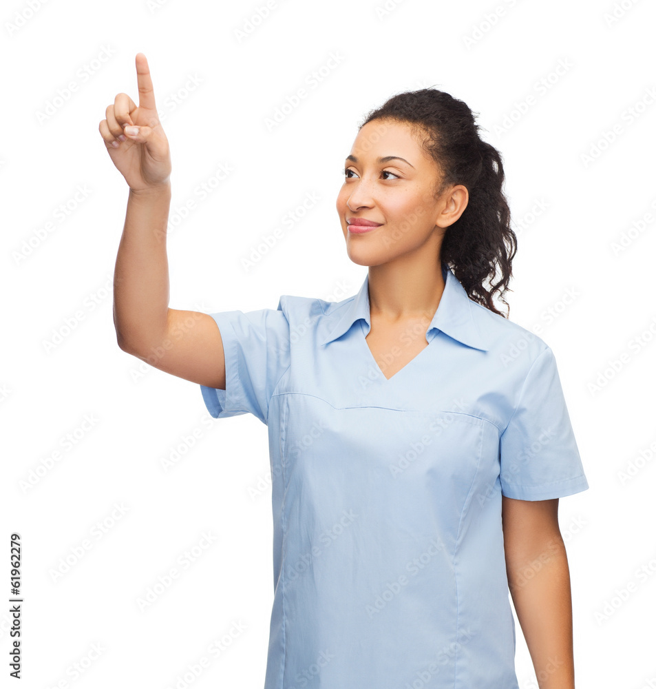 smiling doctor or nurse pointing to something smiling doctor or nurse pointing to something