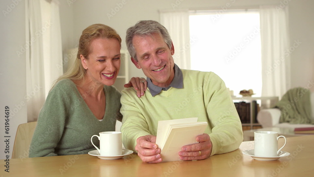 Mature couple looking at photos Mature couple looking at photos