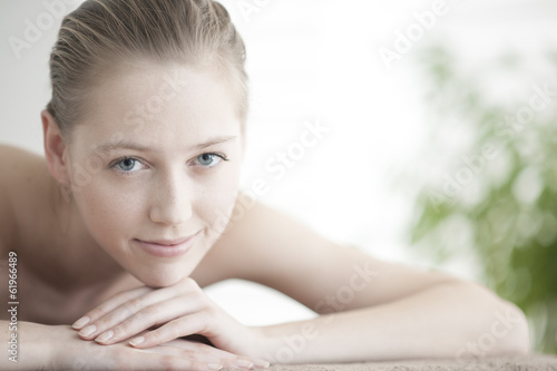 closeup of a beautiful young woman lying on a massage table