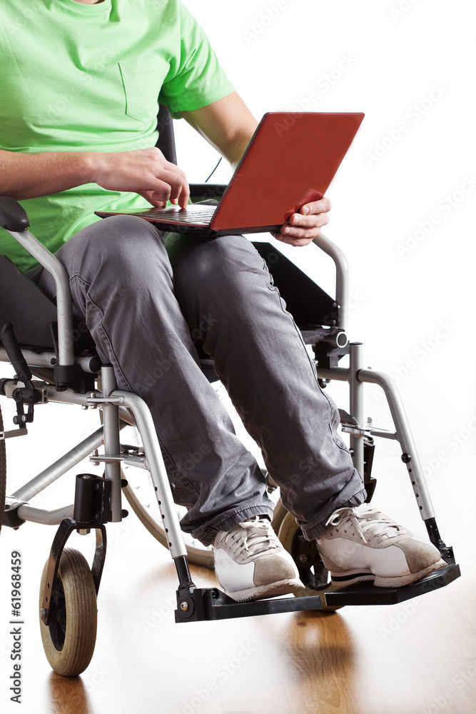 Disabled man working on laptop Disabled man working on laptop