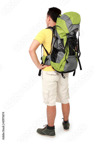 male hiker with backpack shoot from behind