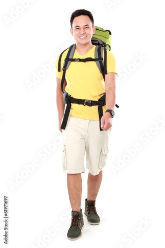 male hiker with backpack walking