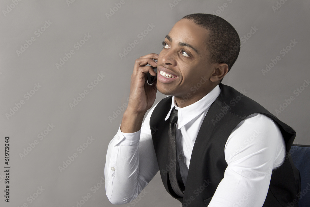 Young Black Man talking on his cellphone Young Black Man talking on his cellphone
