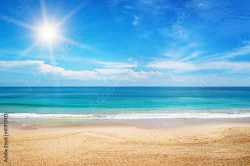 seascape and sun on blue sky background © alinamd