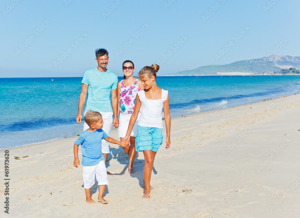 family having fun on beach