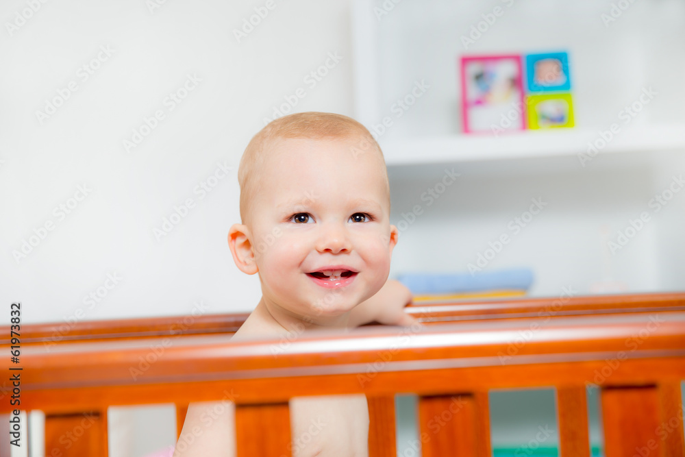 Baby boy standing in crib Baby boy standing in crib
