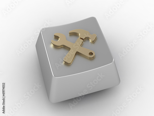 Silver key button with tool...