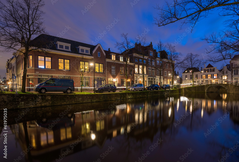 Tranquil evening by the canal in the old city of Delft, The Neth