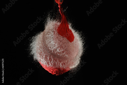 Red balloon with water exploded