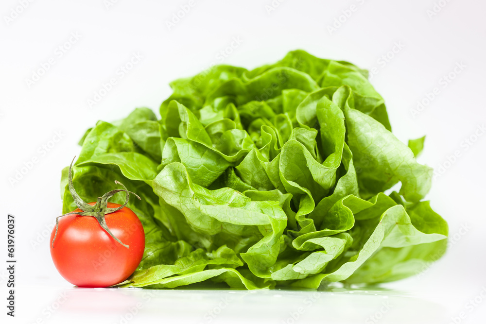Fresh green salad and red bio tomato as healthy breakfast Fresh green salad and red bio tomato as healthy breakfast