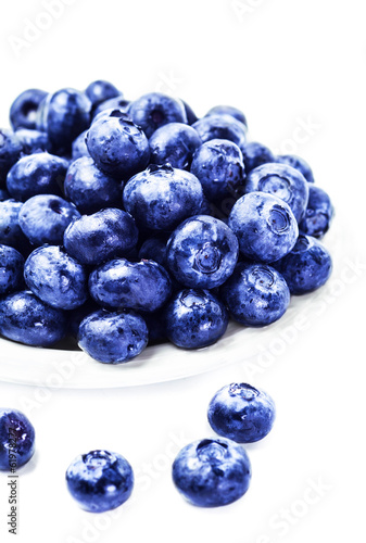 Fresh Blueberries on white plate isolated on white background cl