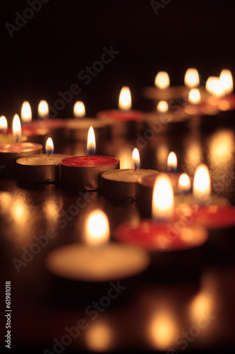 Photograph of candles on black background