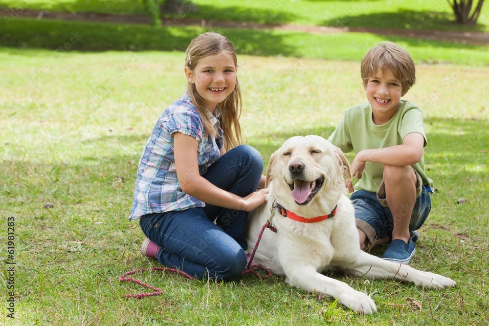 Portrait of kids playing with pet dog at park Portrait of kids playing with pet dog at park