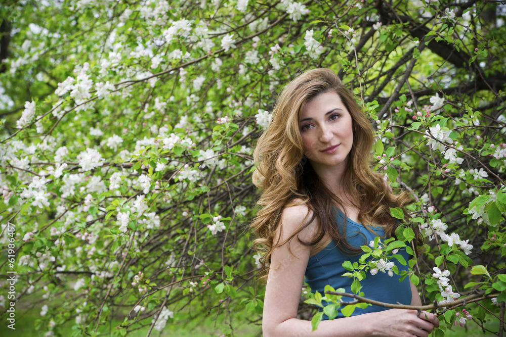 Naklejka premium Beautiful woman in garden.