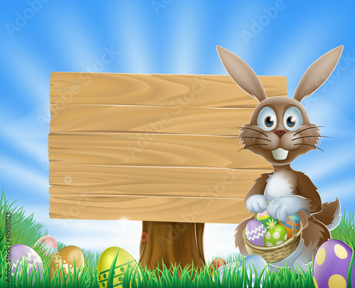 Easter eggs bunny and wooden sign